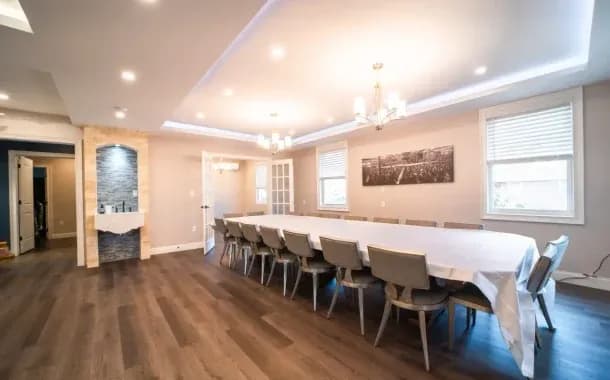 The open dining room with its long solid wood table